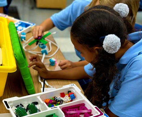 Girls creating Lego® Robotics